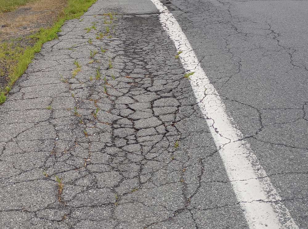Section of road with server gatoring/cracking.
